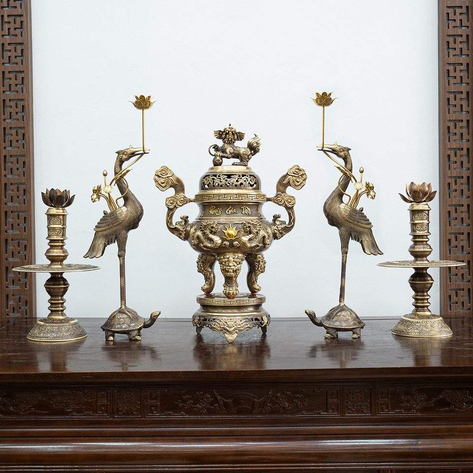 Five-piece bronze altar set in antique patina on a hardwood altar table